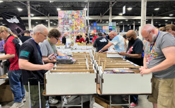 Motor City Comic Con attendees browse through comic books for sale at Suburban Collection Showplace on May 16, 2025, in Novi, Mich.