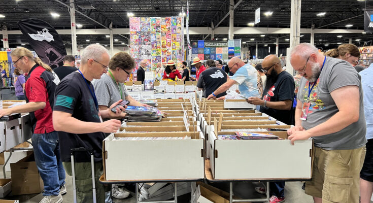 Motor City Comic Con attendees browse through comic books for sale at Suburban Collection Showplace on May 16, 2025, in Novi, Mich.
