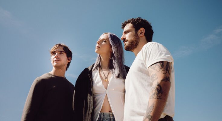 Canadian band Wild Rivers with a blue sky background.