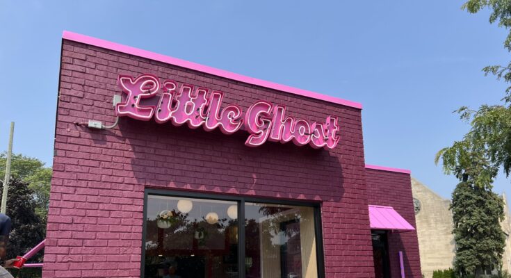 A photo of the exterior of Little Ghost, a pink building.