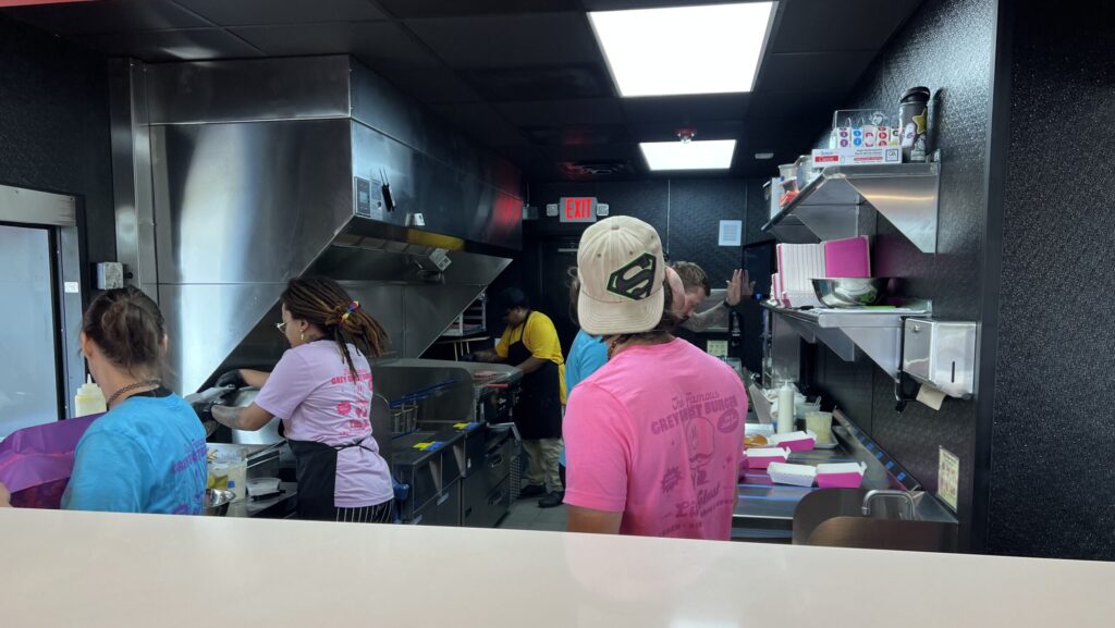 The kitchen staff at Little Ghost prepares orders.