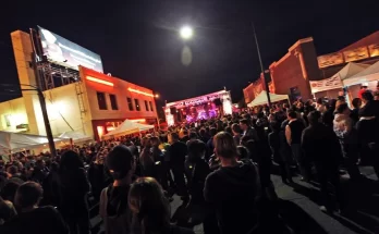A photo of a band performing during DIY Street Fair at night.