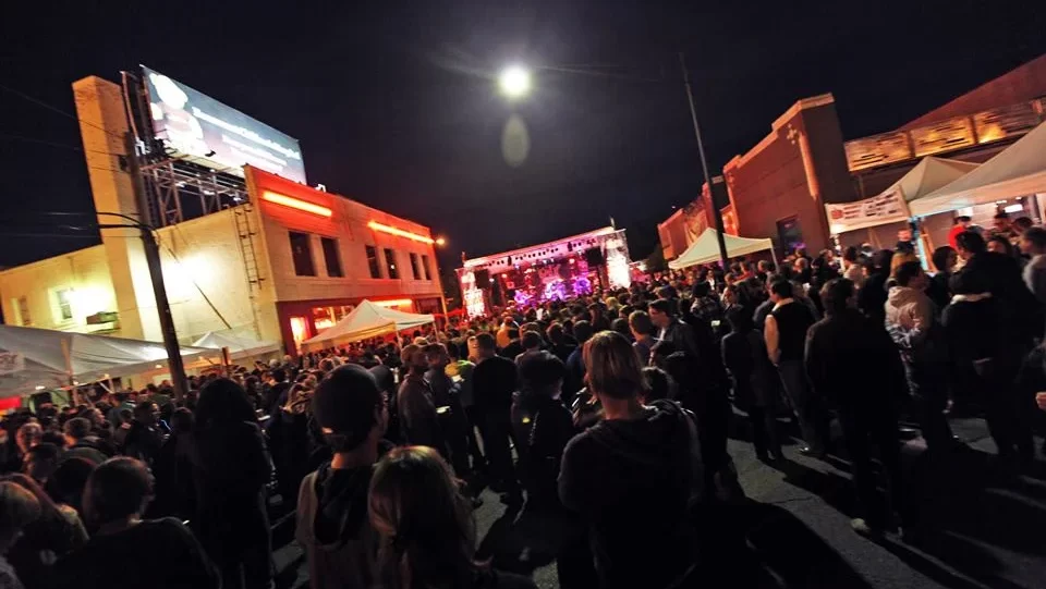 A photo of a band performing during DIY Street Fair at night.