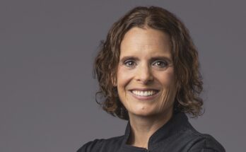 Chef Amber Poupore wearing a black shirt in a headshot.
