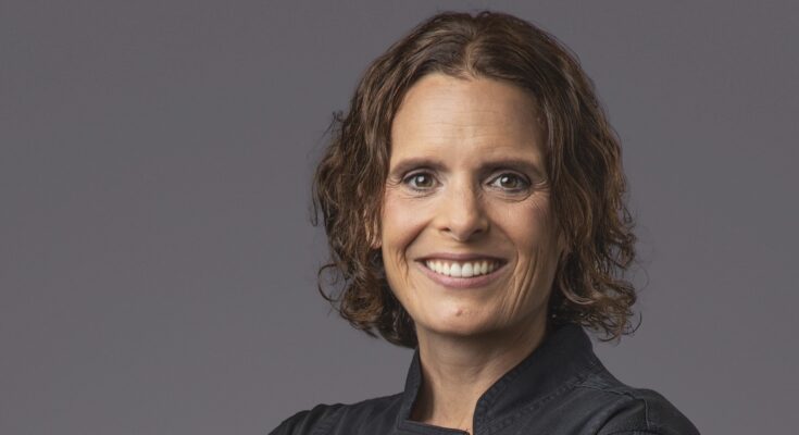 Chef Amber Poupore wearing a black shirt in a headshot.
