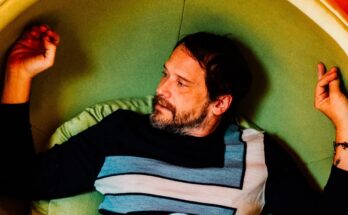Silversun Pickups frontman Brian Aubert sitting down.