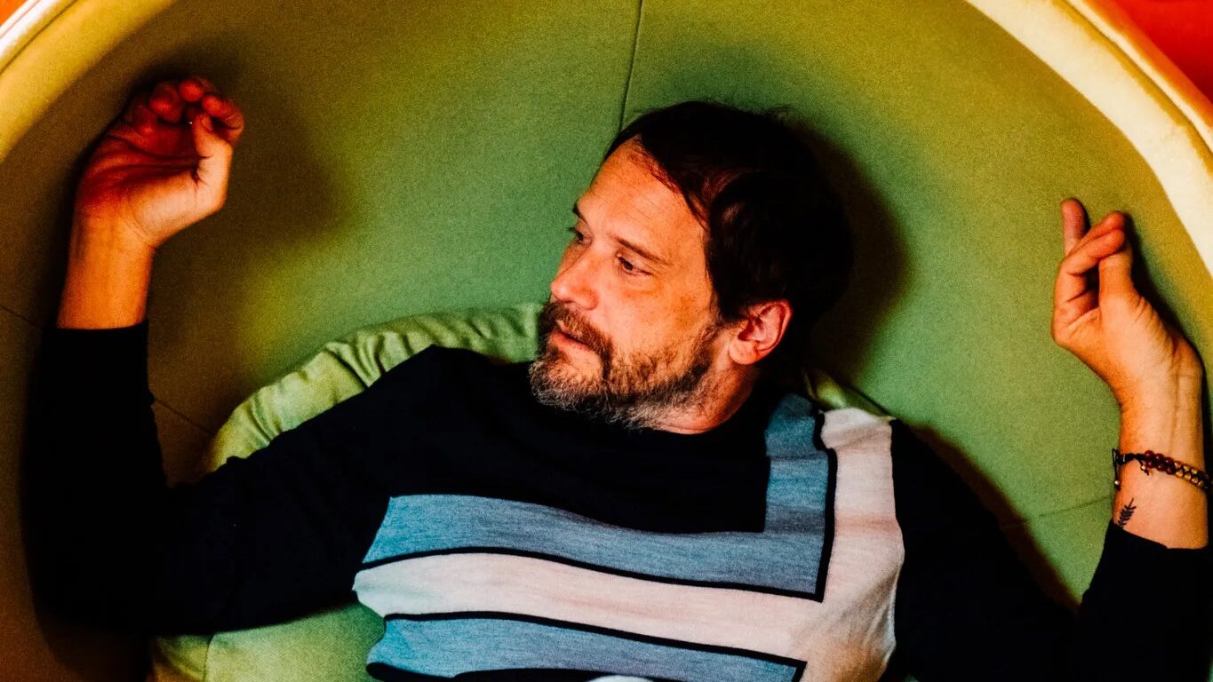 Silversun Pickups frontman Brian Aubert sitting down.