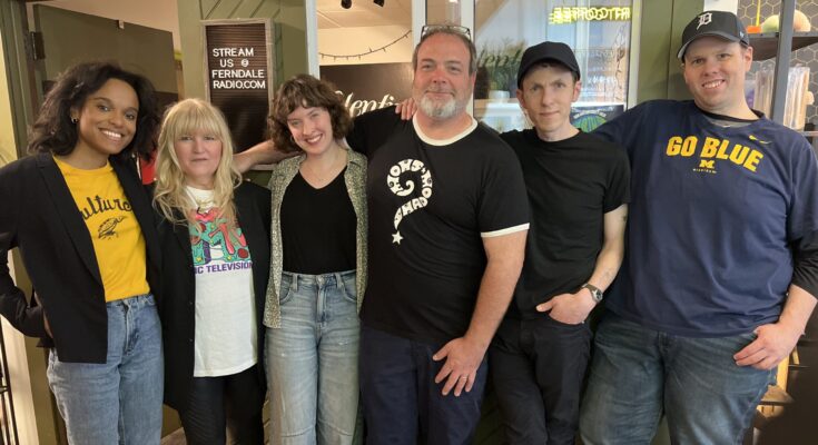 The 11th Hour hosts and Jeff and Mike Milo poses in front of the Ferndale Radio studio.